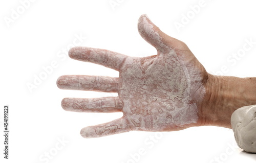 Dirty clay hands isolated on white background