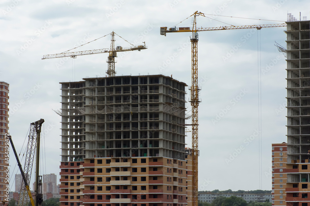 construction of high-rise buildings made of bricks and concrete using high-rise cranes construction of high-rise buildings made of bricks and concrete using high-rise cranes