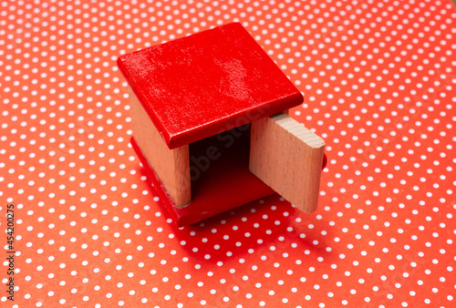 High-angle shot of a wooden Puzzle box on a dot patte photo