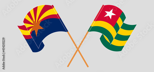Crossed and waving flags of the State of Arizona and Togo
