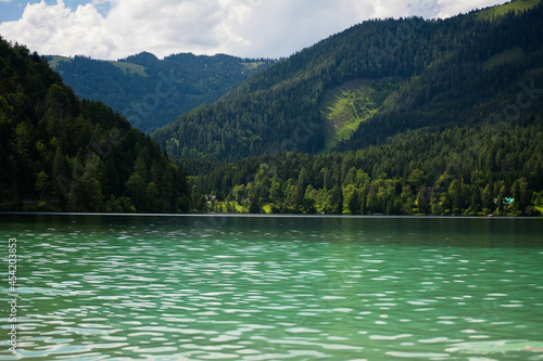 View of beautiful lakes located in the Austrian Alps. The largest and most famous lakes include the famous Wörthersee and Ossiachersee, where you can enjoy both swimming and vibrant evening entertainm photo