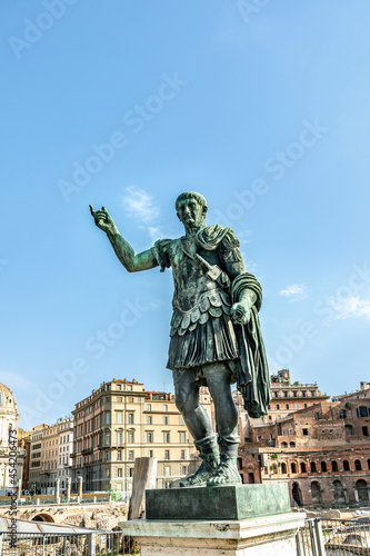 Statue of Trajan with inscription S.P.Q.R. IMP.CAESARI.NERVAE.F.TRAIANO OPTIMO PRINCIPI1 - engl: Trajan served as the Roman Emperor from 98-117 - on street Via dei Fori Imperiali, Rome photo