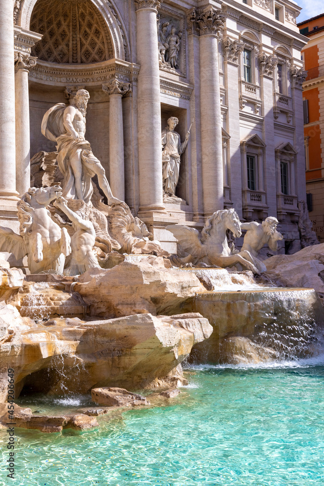 famous trevi fountain in rome with flowing water