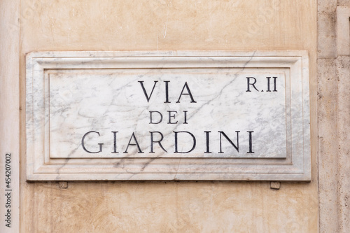 marble plate with Street name via del Giardini - engl: Giardini street - at the wall in Rome
