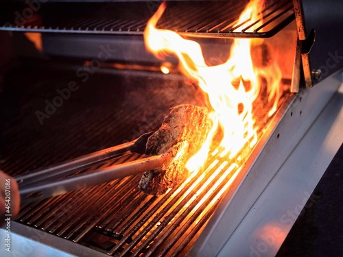 Grilling a steak on gas grill 