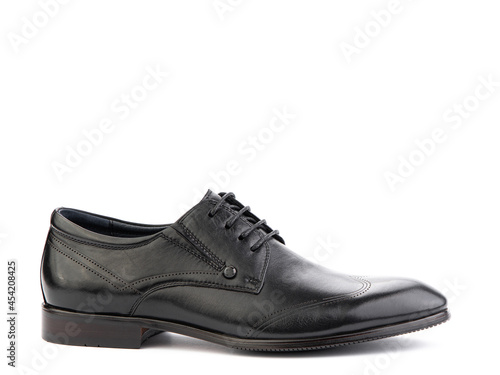 A pair of classic leather elegant men's shoes isolated white background. Groom's stylish black shoes. Isolated object close up on white background. Right side view.