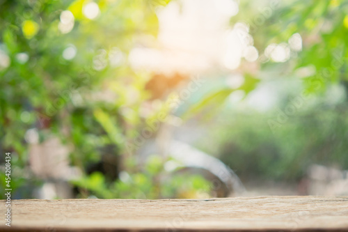 Empty wood table top and blur nature background with copy space for display or montage your products