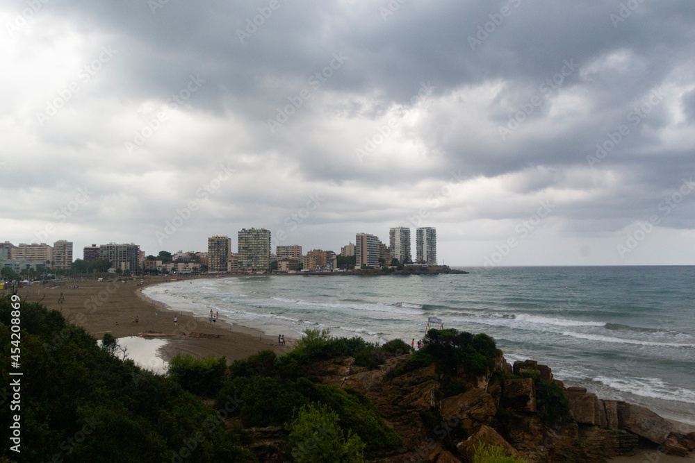 Views of the Oropesa del Mar beach on a cloudy day, in Castellón. Views of the Mediterranean Sea, in Spain. Europe. Horizontal photography.