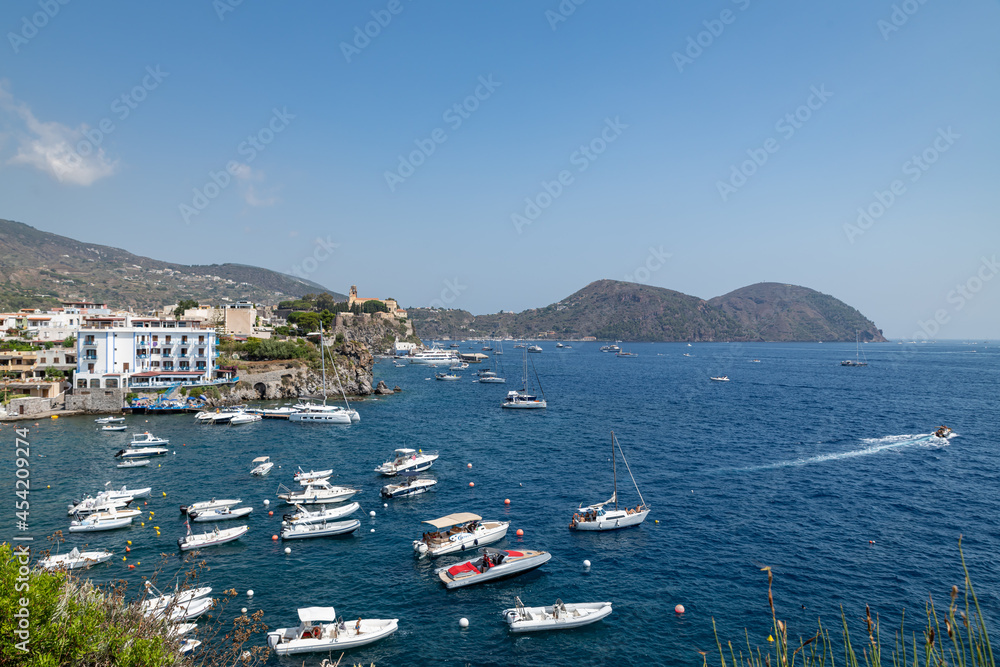 Lipari island (Aeolian archipelago), Messina, Sicily, Italy, 08.13.2021: view of the tourist port with the  old castle.