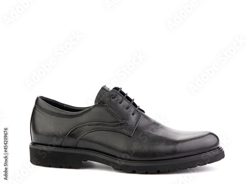 A pair of classic leather elegant men's shoes isolated white background. Groom's stylish black shoes. Isolated object close up on white background. Right side view.