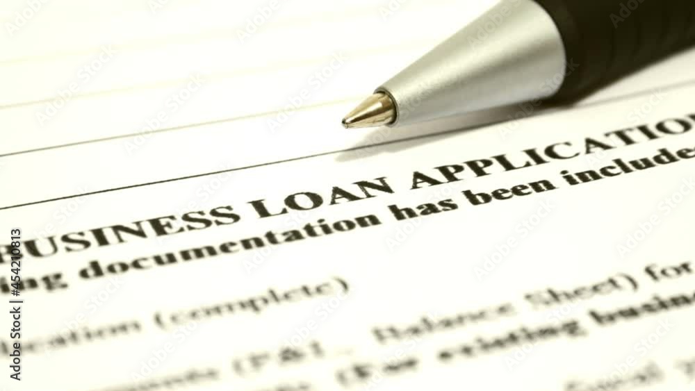 Close up of business loan application dolly shot Close up of business loan application dolly shot