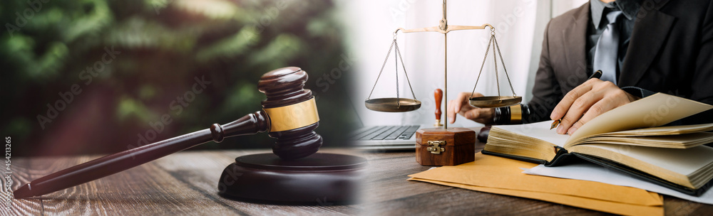 justice and law concept.Male judge in a courtroom on wooden table and Counselor or Male lawyer working in office. Legal law, advice and justice concept. justice and law concept.Male judge in a courtroom on wooden table and Counselor or Male lawyer working in office. Legal law, advice and justice concept.