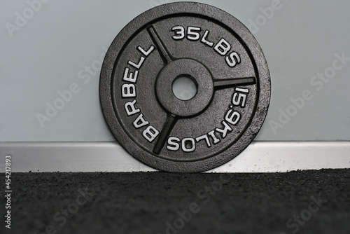 Olympic thirty-five pound weight platter.