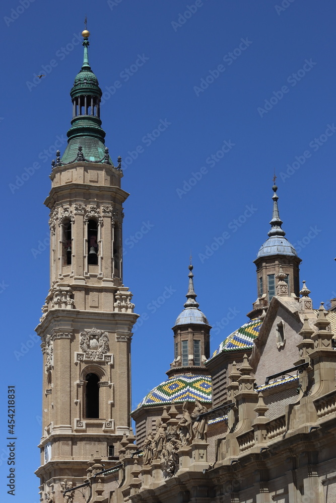 Image of a tower and colourful domes of the Cathedral Basilica of Nuestra Señora del Pilar in Zaragoza, Aragon, Spain. Vertical image.