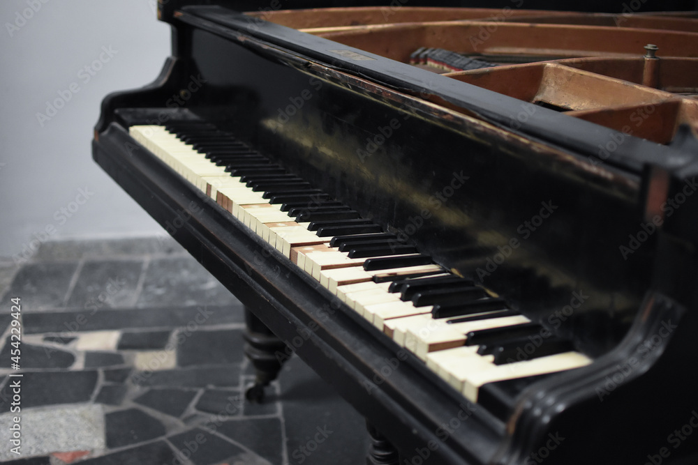 Demolished abandoned piano in empty room Demolished abandoned piano in empty room