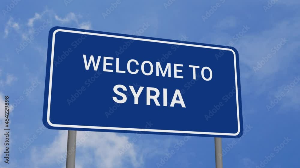 Welcome to Syria Road Sign on Clear Blue Sky with Rapid Moving Clouds Welcome to Syria Road Sign on Clear Blue Sky with Rapid Moving Clouds