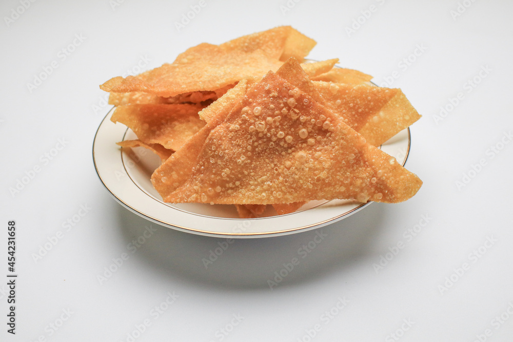 Fried wontons with minced pork meat on white background. Asian Style food appetizer. Chinese food,asian food. Fried wontons with minced pork meat on white background. Asian Style food appetizer. Chinese food,asian food.