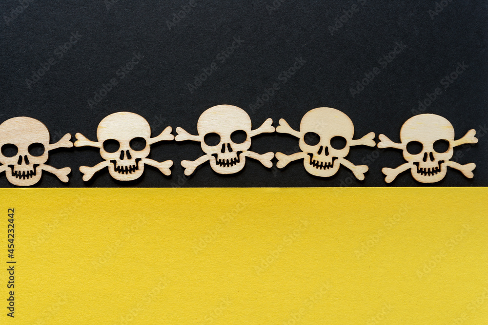 laser cut wooden shapes arranged in a row on a geometric paper background - halloween or pirate theme laser cut wooden shapes arranged in a row on a geometric paper background - halloween or pirate theme