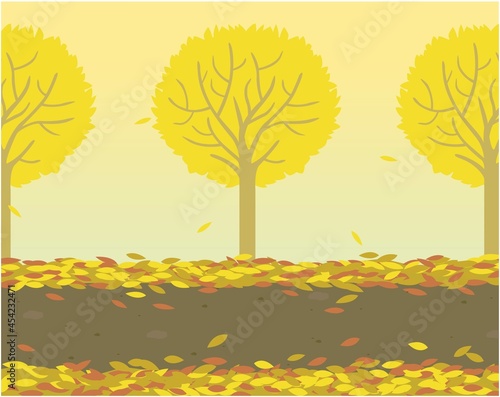 秋に色づく並木と落ち葉の道