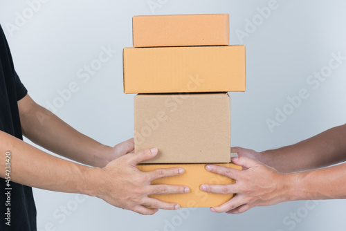 woman receive box from delivery man 