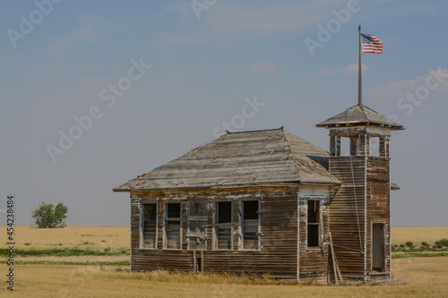 The abandoned and rundown Burnham Schoolhouse in Havre, Hill County, Montana  photo