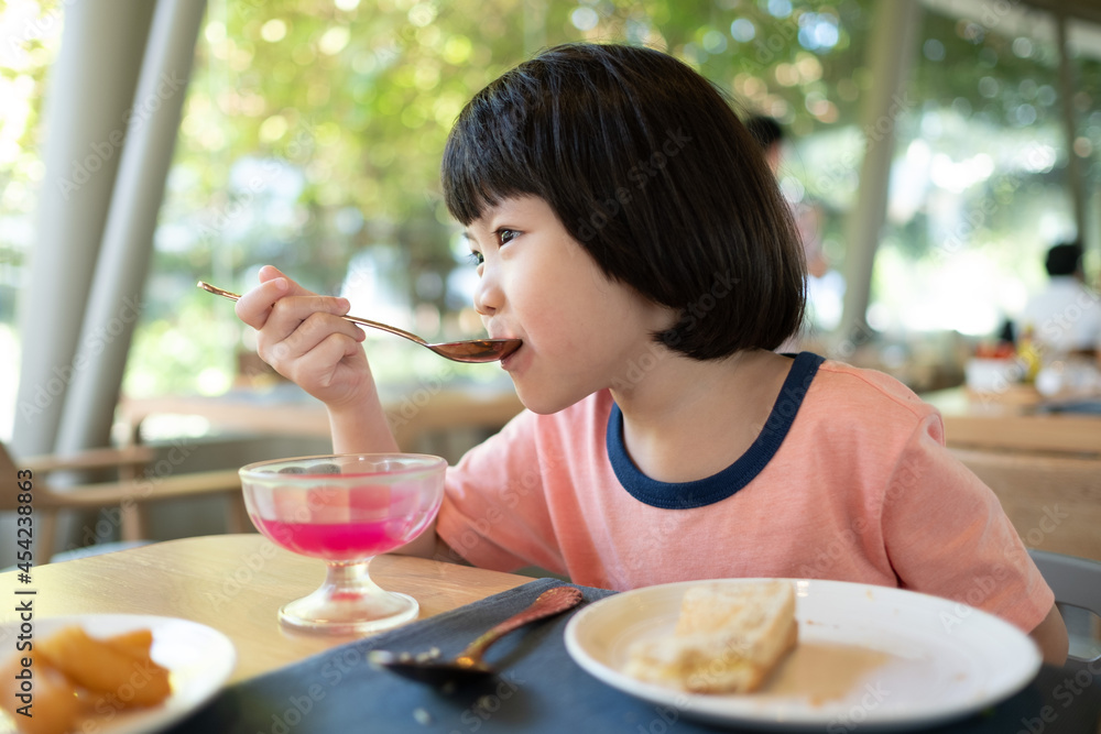 Asian children enjoy eating food
Asian children enjoy eating food