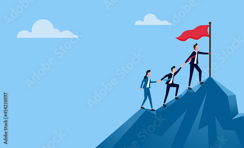 Successful business team. Business people climbing to the top of mountain.