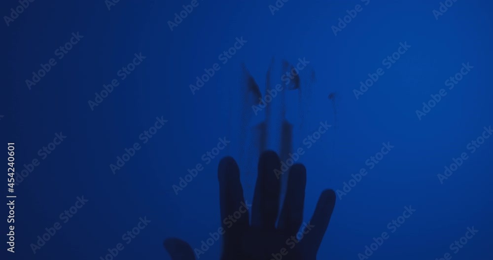 A bloody hand dragging down on window A bloody hand dragging down on window