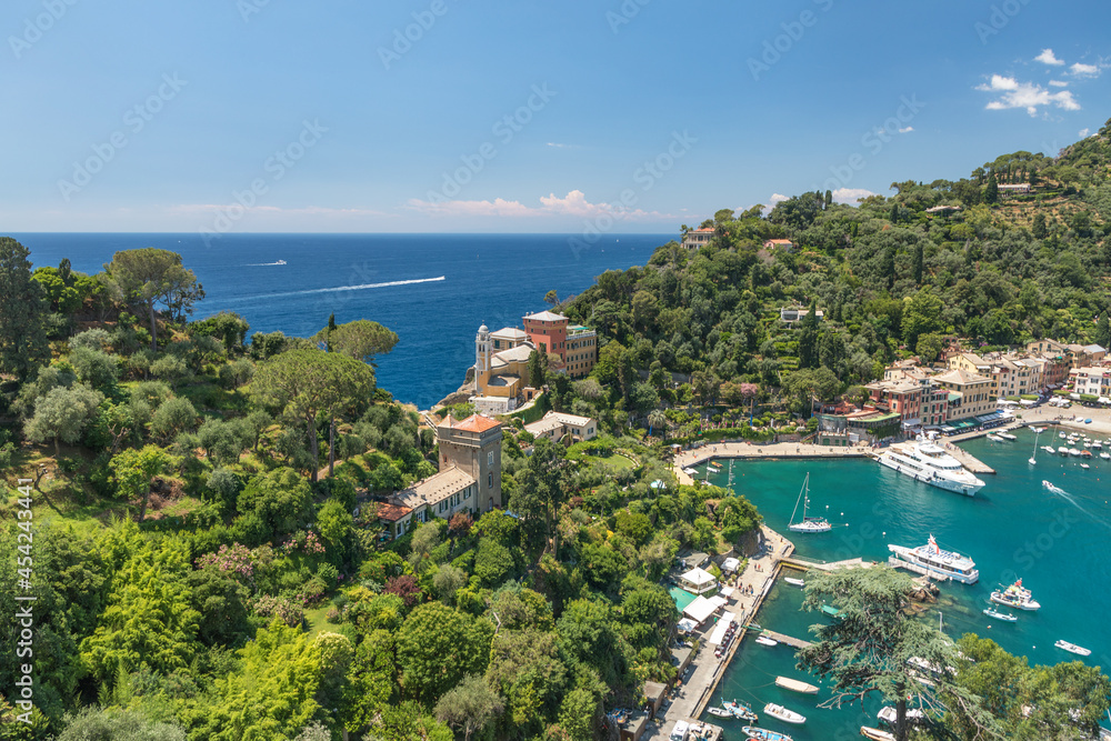 Panoramic overview of Portofino seaside area, harbour with numerous of yachts and ships, view from Castello Brown, Liguria, Italy