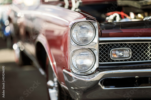 Classic car show, close-up on vehicle headlights, vintage color © Mariusz Blach