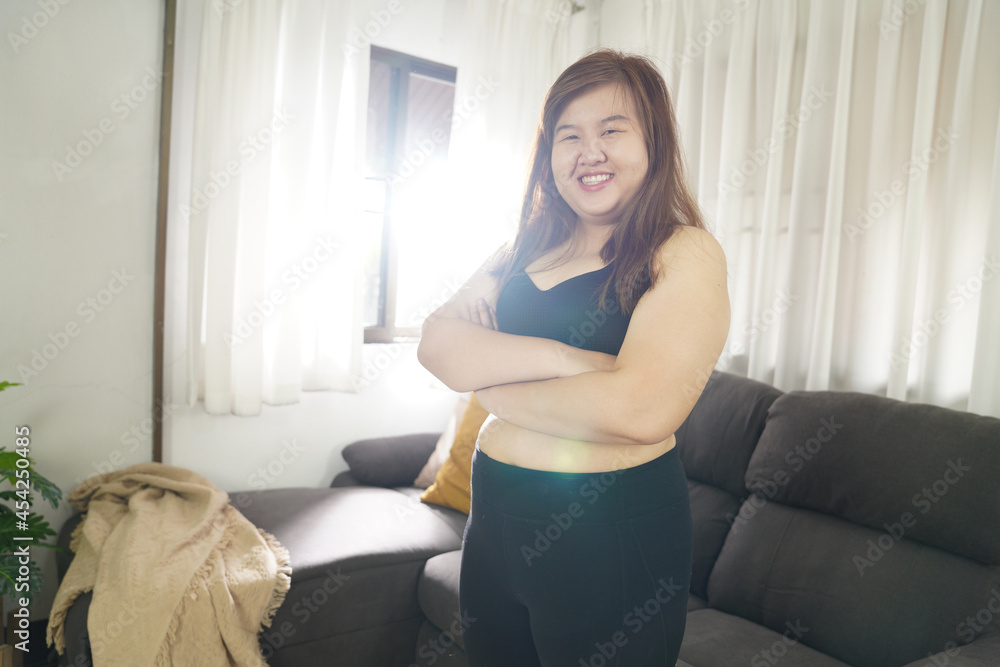 Body confidence. Asian woman Overweight plus size woman wearing sportswear for exercising. self confident Body positive concept. Body confidence. Asian woman Overweight plus size woman wearing sportswear for exercising. self confident Body positive concept.