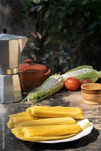 Humitas, typical Andean food. Traditional food made from corn. Outdoor breakfast. photo