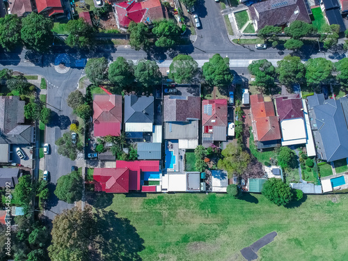 Panoramic Aerial Drone view of Suburban Sydney housing, roof tops, the streets and the parks NSW Australia