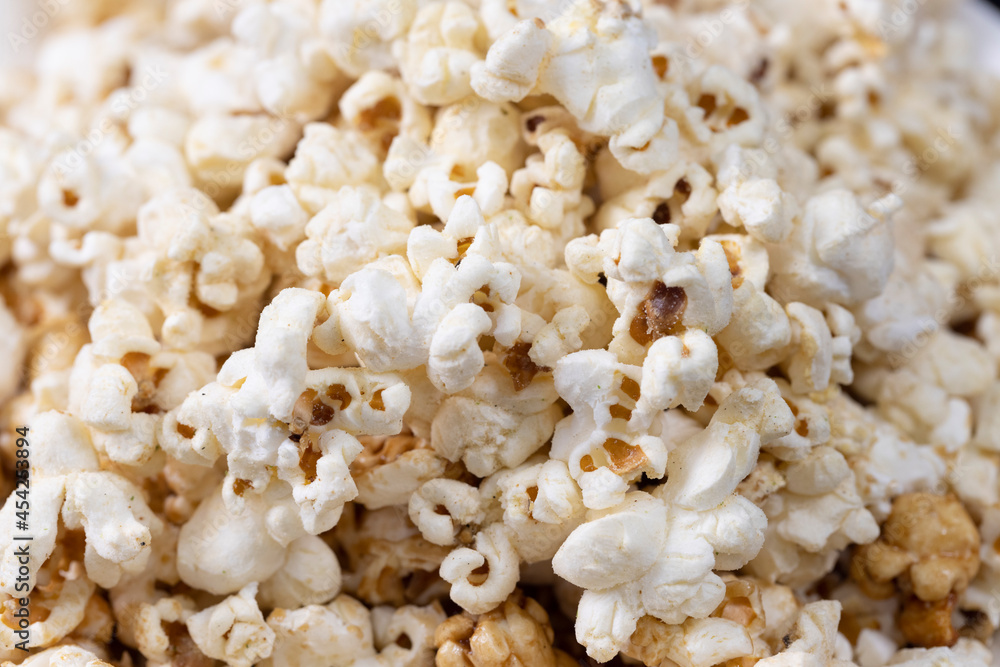 Close-up of Salt popcorn on the bowl, selective focus Close-up of Salt popcorn on the bowl, selective focus