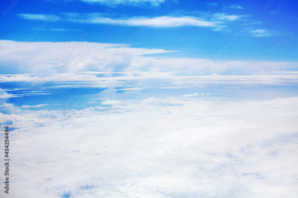 White clouds on blue sky background view from above, airplane flight landscape, beautiful aerial cloudscape, skies backdrop, fluffy cloud texture, sunny heaven, cloudy weather, cloudiness, copy space