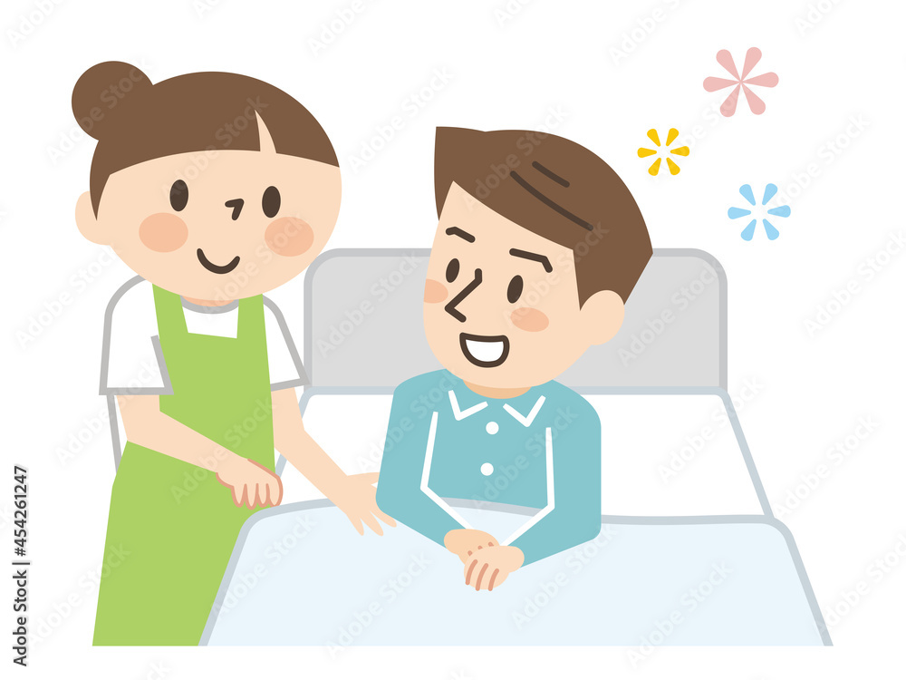 ベッドに横たわる男性と介護する女性の介護士