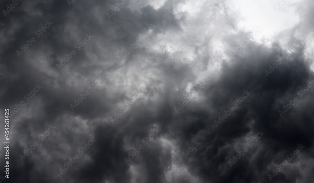 Dark dramatic storm background with gray and black clouds Dark dramatic storm background with gray and black clouds