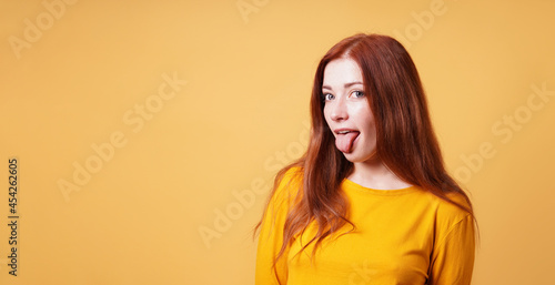 cheeky young woman sticking out her tongue © Axel Bueckert