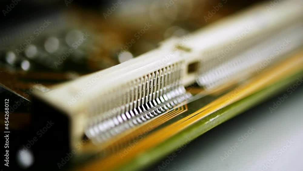 Silver Steel Part On Side Of A Printed Circuit Board. macro, rack focus Silver Steel Part On Side Of A Printed Circuit Board. macro, rack focus