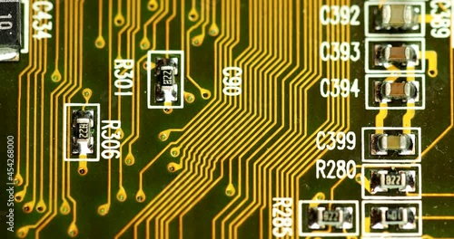 Computer Motherboard With Capacitors And Resistors. Reference Designators Printed On Surface. close up photo