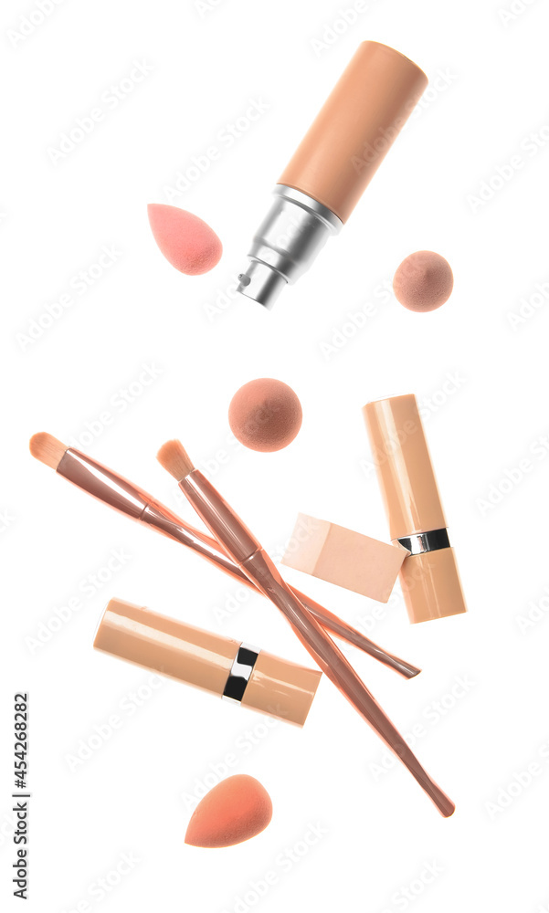 Tonal foundation with makeup brushes and sponges on white background Tonal foundation with makeup brushes and sponges on white background
