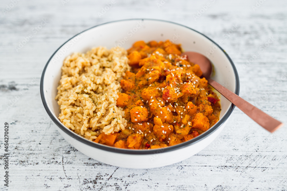vegan pumpkin and bel pepper curry with brown rice, healthy plant-based food vegan pumpkin and bel pepper curry with brown rice, healthy plant-based food
