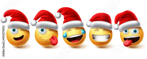 Christmas smiley emoji vector set. Emojis xmas characters wearing santa red hat icon collection isolated in white background for graphic design elements. Vector illustration.