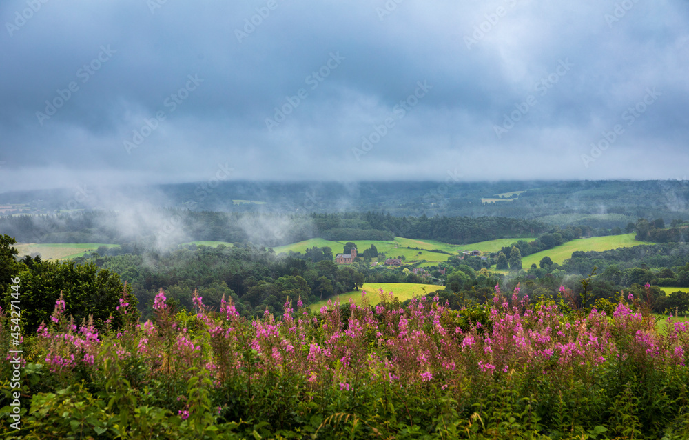 Obraz premium View from Newlands Corner on the Surrey Hills, North Downs on a wet cloudy day in early August