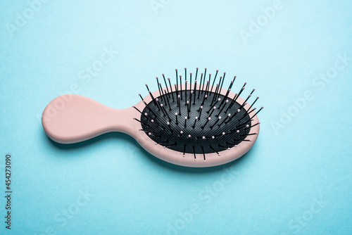 An anti-static comb on a blue background