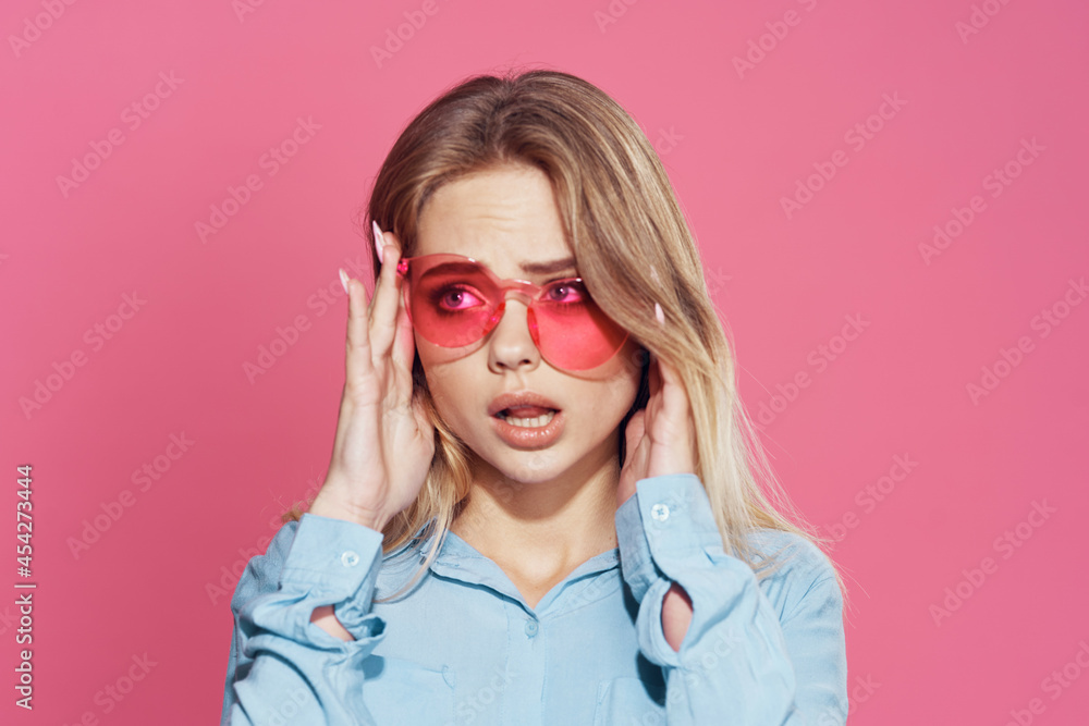 woman in blue shirt pink glasses fashion glamor posing pink background woman in blue shirt pink glasses fashion glamor posing pink background