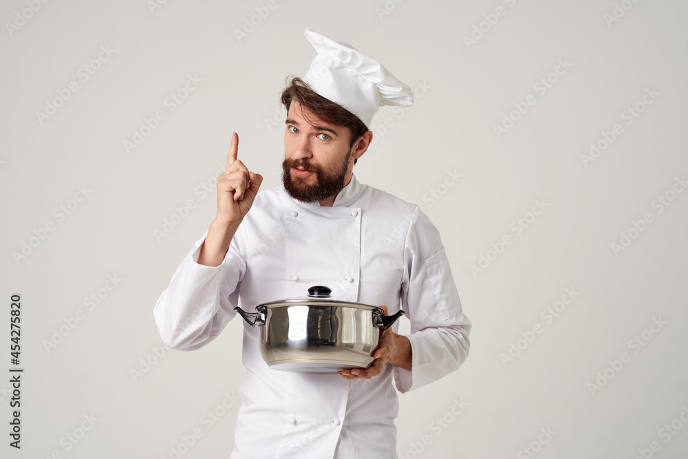 chef with a saucepan in his hands emotions discontent improper cooking chef with a saucepan in his hands emotions discontent improper cooking