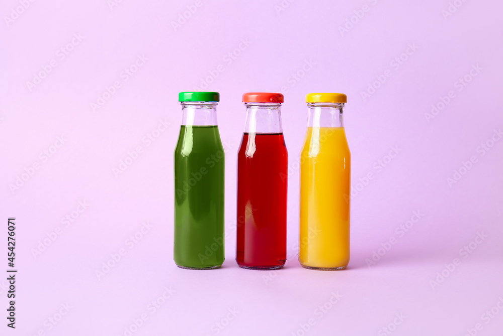 Different healthy juice on color background Different healthy juice on color background