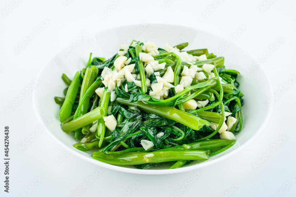 Garlic convolvulus in a dish on white background Garlic convolvulus in a dish on white background