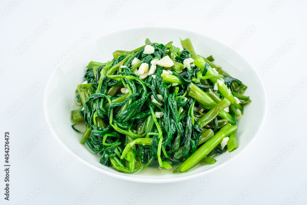 Garlic convolvulus in a dish on white background Garlic convolvulus in a dish on white background